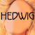 A pixelated image of a person with light brown hair and visible facial features, including eyes, nose, lips, and eyebrows.