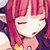 Pixelated static image of a character with pink hair and closed eyes, wearing dark clothing with yellow accents.