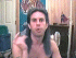 A shirtless person with long dark hair tied back in a ponytail appears in three showing hand gestures and facial expressions