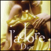 A golden bottle with a crown-shaped cap is held by hands against a warm-toned background, with 'J'adore Dior' text overlaid.