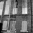 A static image with a red background divided into four quadrants containing black text and one grayscale photo of a building.