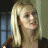 A pixelated image of a person with long blonde hair against a dark background, next to green text reading 'Original Icons .com' on a solid green backdrop.
