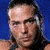 A pixelated image of a person with long hair against a blue background, split into four quadrants with red and black text overlays.