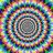 A static pixelated image with two identical spiral patterns on a multicolored background, featuring the text "tip" in black letters.