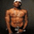 A pixelated buddy icon featuring a shirtless man with dark skin wearing black shorts and a white cap, standing against a dark background on the left side of a contact sheet, next to a purple panel with partially visible pink text reading "HOT IN" and "HERE".