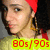 Pixelated close-up of a person with light skin wearing red headwear and gold earrings, overlaid with bright yellow text reading '80s/90s' in bold red numerals.