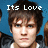 Pixelated image of a person with brown hair against blue background, white text reading 'Its Love' above head.