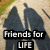 Two side-by-side pixelated images: left shows silhouettes of two figures walking on a path with text "Friends for LIFE"; right displays a cyan heart shape with "u.k.w.u.o." text.