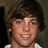 Pixelated image of a person with brown hair and light skin on left, pink background with red pixelated text reading 'i think ryan seckler is... wiked hotttt!!!' on right.