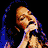 A 6-frame contact sheet of a woman singing into a microphone, displayed in a 3x2 grid with visible pixelation and color banding.