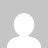 A static pixelated image of a white circular shape against a gray background with faint darker gray accents.