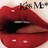 Red lips with glossy texture and dark interior mouth cavity, partially visible text above.