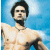 A pixelated contact sheet showing two frames of an animated buddy icon with a shirtless man on the left and green text on a dark background on the right.