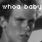Pixelated grayscale image of a person's face with text overlay reading 'whoo baby' in blocky white letters.