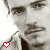 A 2x2 contact sheet of a black-and-white animated icon featuring a man's face with three red heart symbols in different positions across frames.