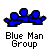 Two pixelated blue figures in a group pose with one figure extending an arm, displayed above text reading "Blue Man Group" on gray background.