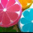 Pixelated fruit slices in pink, orange, and blue with green background; yellow text "Pretty colors" appears on right side.