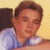 A pixelated image split into two sections: a person in light clothing on the left and yellow text on blue background on the right.