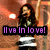 Pixelated image of a person with long dark hair wearing a black jacket and white shirt, standing against an orange-toned background with text overlay.
