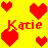 Pixelated heart shapes in red, green, blue, cyan, and pink surround the repeated name 'Katie' on a bright yellow background.