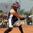 Pixelated image of a softball player in mid-swing with red text overlay praising Rachel's skills.
