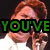 A four- of a person with brown hair holding a microphone, with green text overlay reading YOU'VE BEEN RICK ROLLED