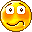 Three pixelated yellow-orange circular faces with distinct eye and mouth expressions against a gray background.