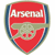 Static pixelated shield-shaped logo with red background, blue border, and green cannon symbol featuring the word "Arsenal" in white text at top.