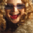 Pixelated close-up of a person with dark hair and red lips wearing sunglasses, set against a warm-toned background.
