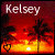 A 50x50 pixel animated buddy icon showing a sunset beach scene with palm trees and the name "Kelsey" at the top, featuring two frames where a heart symbol changes from black to white.