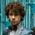 Pixelated image of a person with curly brown hair wearing a light blue shirt against a teal striped background, next to text reading "The BOY of my dreams" with a red heart symbol.