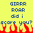 Yellow background with blue pixelated text reading "GIRRR ROAR did i score you?" and red-orange flame-like shapes at the bottom.