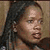 Static 50x50 pixel buddy icon showing a close-up of a person's face with dark hair and neutral expression against a muted background.