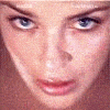 Two side-by-side close-up views of a person's face showing different eye expressions and head angles.