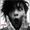 Black-and-white image of a person with tousled hair holding hands near their face, mouth open in surprise, with "OMG!" text below.