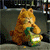 Animated orange tabby cat with green eyes holds a green and white striped bag, shifting pose across frames.