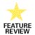 A pixelated yellow star above bold black text reading 'FEATURE REVIEW' on a white background.