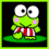 Green cartoon frog with large white eyes and pink cheeks stands on green base, wearing red-and-white striped shorts.
