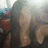 Pixelated image of a person with long hair and a dark top, with pink text reading 'sam<3' overlaid on the right side.