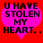 Two identical pink heart-shaped icons with black text on red background, each displaying "U HAVE STOLEN MY HEART.." in pixelated font.