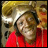 A pixelated image shows a person with light brown hair wearing a red top on the left, next to colorful pixelated text reading "flavor" and "flav!!!" on a black background.