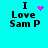 Cyan background with black text "I Love Sam P" and four variations of pink pixelated symbols above the "I".