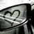 A grayscale pixelated icon shows a stylized heart shape with a question mark inside, set against a light background with dark borders.