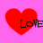 Four red heart shapes on a pink background with the word 'LOVE' in black text overlaid, each heart slightly pixelated and positioned in a