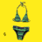Yellow background displays static arrangement of fashion and beauty items including bikini, dress, compact makeup, earrings, perfume bottle, and lip gloss.