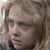 Static pixelated image of a person with light brown hair, blue eyes, and a neutral expression, cropped to show the upper face and shoulders.