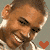 A 50x50 pixel animated buddy icon featuring a smiling man with short brown hair and light skin, displayed as two sequential frames in a contact sheet showing heart symbol animation.