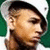 Pixelated close-up of a person with short dark hair, closed eyes, and light skin tone against green background.