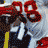 Pixelated football player in white uniform with red number 88, helmet, and face mask; text overlay reads TONY GONZALEZ on red background.