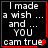 Black background with white pixelated text reading "I made a wish ... and ... YOU cam true" inside red border, featuring animated heart symbol.